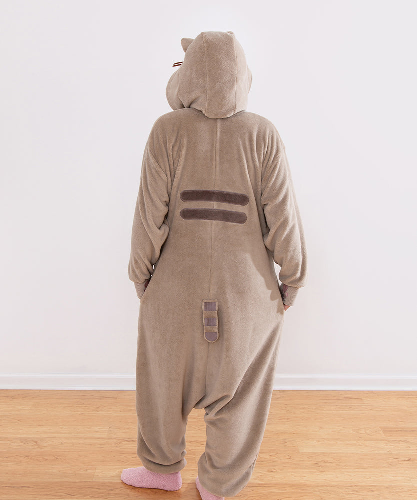 Person wearing a brown and gray onesie with cat ears on the hood. Pusheen's striped tail and back stripes can be seen in this view.