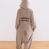 Person wearing a brown and gray onesie with cat ears on the hood. Pusheen's striped tail and back stripes can be seen in this view.