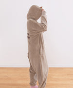 Model standing to the side while wearing the kigurumi onesie to show silhouette of fleece costume.