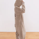 Model standing to the side while wearing the kigurumi onesie to show silhouette of fleece costume.