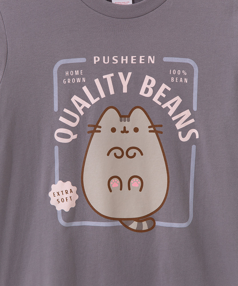 Close-up view of toe beans graphic tee. The phrases surrounded Pusheen the Cat in a light pink font are "Pusheen," "Home Grown," "100% Bean," "Quality Beans," and "Extra Soft."