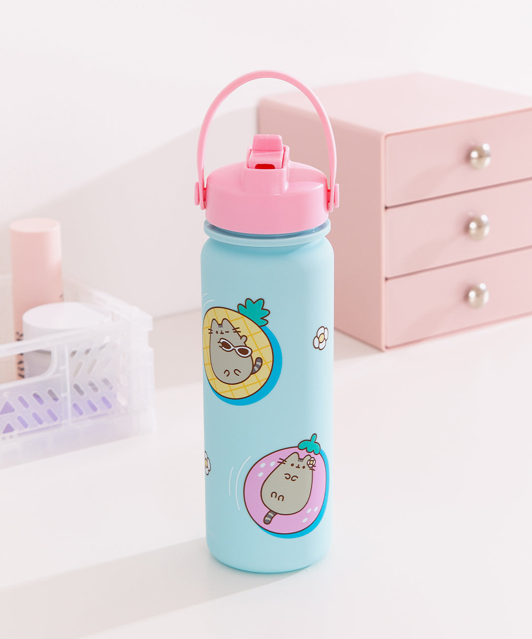 Front view of the Pusheen Tropical Vacation Water Bottle. The blue bottle features a pink carrying ring and flip-top straw.