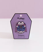 Vampurr Pusheen Pin on a purple card with a light purple background.