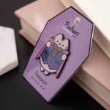 Pusheen Vampurr Deluxe Pin tilted to the side to shown the shiny black outline of the pin.