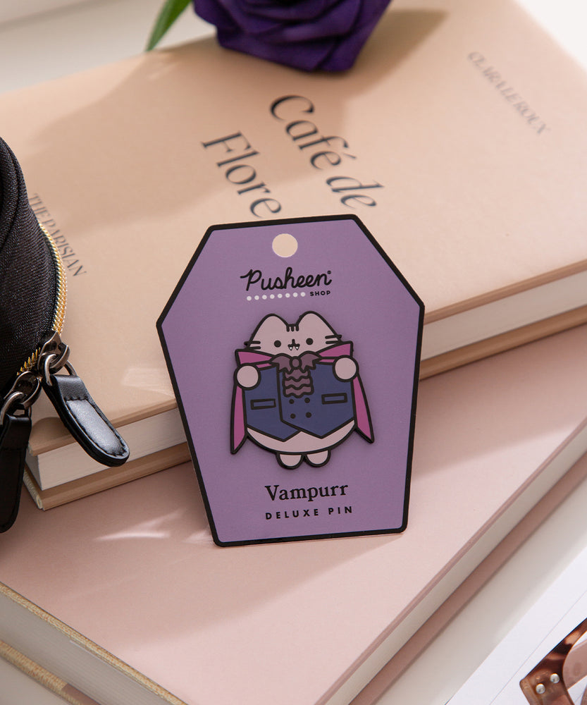 Vampurr Deluxe Pin on its purple and black backer card. The text on the paper card says "Pusheen Shop" and "Vampurr Deluxe Pin."