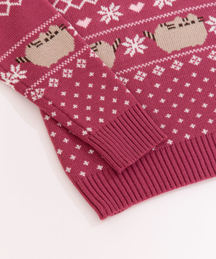 Close-up of the ribbing detail at the cuffs and bottom hem of the knit seater. The red ribbing color matches the knit sweater color.