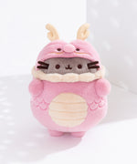 Baby Pink Pusheen Year of the Dragon Plush in front of a white background. The light pink costume plush show Pusheen wearing a dragon costume with light yellow details. 