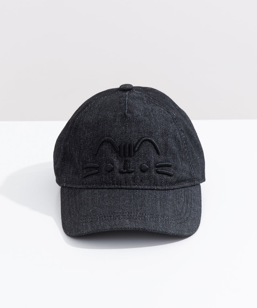 Front view of the black Pusheen Denim Cap. The black heathered baseball-style hat has Pusheen the Cat’s face embroidered in a 3D effect. The black thread is on the front center of the cap. 