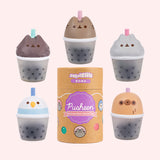 Boba Tea Surprise Squishy characters surround the cardboard packaging capsule that each squishy comes in. The five squishys each stand around 3" tall.