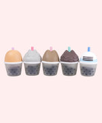 Line up of the Pusheen Bubble Tea Surprise Squishy toys' backs. Each squishy's front coloring and texture matches on the back of each respective squishy.