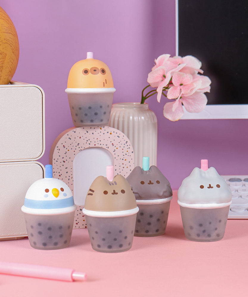 Pusheen Boba Tea Surprise Squishies. The five character stress toys have a character head atop a cup filled with boba pearls.