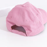 Back view of the light mauve hat. The baseball style cap has a top button, eyelet holes for head ventilation, and an adjustable Velcro strap on the back for customized fit. 