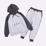 A two-toned gray sweatshirt accompanied with the matching two-toned jogger-style pants. The unisex sweat set has an embroidered graphic of Pusheen the Cat’s face on the hoodie.  