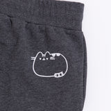 Close-up of the embroidered Pusheen graphic on wearer's back hip. The embroidery thread color is white and shows Pusheen lying down.