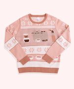 Light-brown and medium-brown knit sweater lies on a white background. The sweater has graphics of Pusheen the Cat and coffee making items.