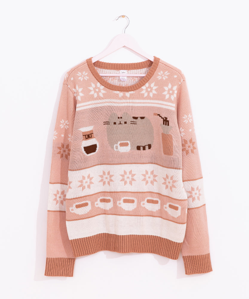 Pusheen Coffee Break Knit Sweater hands on a hanger to show the full length of the brown-toned Pusheen sweater.