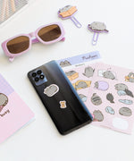 Two Pusheen sticker sheets featuring Pusheen the Cat, Stormy cat, Pip Cat, Cheek the Hamster, and Sloth graphics.