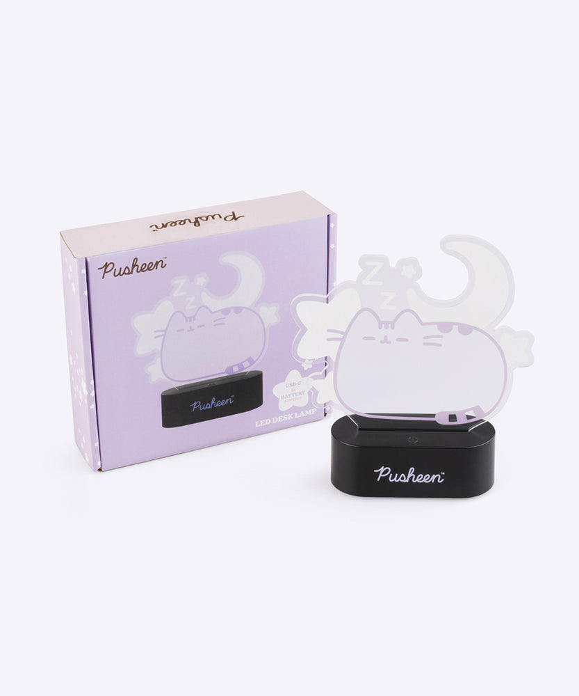 Pusheen Lamp in front of its purple packaging that includes more product details.