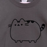 A close-up view of the embroidered graphic on the front center chest of the sweatshirt. The classic Pusheen pose shows her ears, whiskers, back stripes, and striped tail in a dark black thread. 