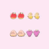 All earrings in Pusheen Fruits 4-Pack Stud Earrings Stud shown. From left to right and top to bottom, the stud earrings include Pusheen as fresh fruits including apples, bananas, peaches, and grapes. 
