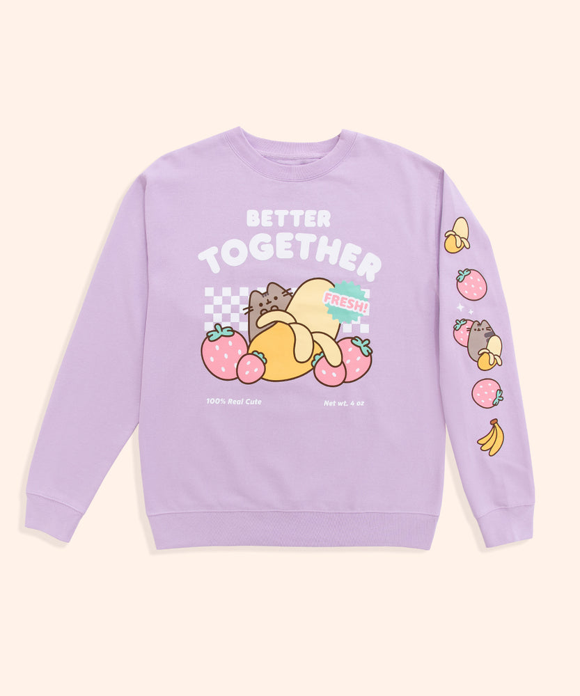 Front view of the Pusheen Fruits Better Together Sweatshirt. The text on the sweatshirt is printed in white. The phrases on the front graphic say "Better Together," "100% Real Cute," and "Net wt. 4 oz".