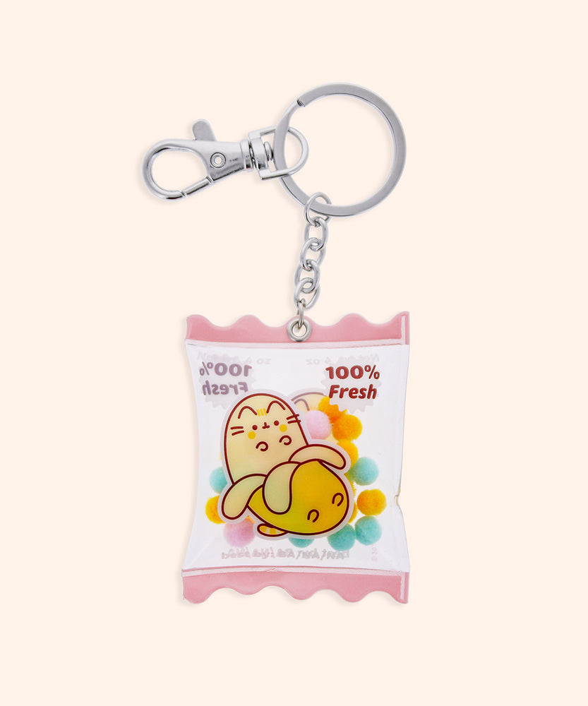 Back view of the Banana Pusheen Keyring. The clear plastic dangle has a pink scalloped border on the top and bottom of the keychain.