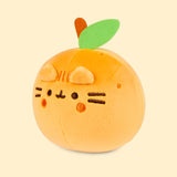 Left quarter view of the orange-colored Pusheen Squisheen. In this angle, the dark orange embroidered spots doting around the top of the small plush can be seen. 