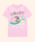 A light pink graphic tee against a light-yellow background. The center graphic features Pusheen among two peaches showing off her booty.  The Pusheen Fruits graphic features the phrase “peachy” above the Pusheen graphic and “100% Real Cute, Best By: Forever, and Net wt. 4oz” under the Pusheen print. 