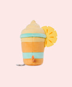 Back view of the Pusheen Fruits Pineapple Float Plush. Pusheen's striped tail extends off the back of the drink-inspired plush. The cylinder base is topped with a fuzzy whipped plush topping and a two-toned pineapple slice.