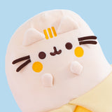 Close-up view of Banana Plush. Pusheen the Cat takes the form of a delicious yellow banana that sits upright. Pusheen's front paws indicate a "gasp" expression.