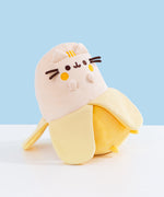 Quarter side view of the Scented Banana Squisheen. The plush sits upright via plastic pellets.