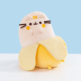 Front view of the Banana Plush. Pusheen the Cat's classic facial features are embroidered in dark brown while her blush and three head stripes are embroidered in a golden yellow thread.