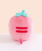 Back view of the Strawberry Squisheen Plush. On the back of the plush are embroidered red stripes to mimic Pusheen’s classic back stripes. Extending off the bottom back of the Pusheen is a pink and red striped tail. 
