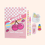 Contents of the Pusheen stationery set in front of a light green background. The set includes a pink notebook, printed pencil, ballpoint pen, highlighter, sticky notes, and an eraser.