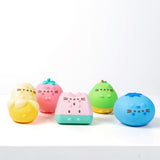 Front view of the five squishys in the Surprise Set. Each water-filled squishy show Pusheen taking the form of an adorable Fruit.