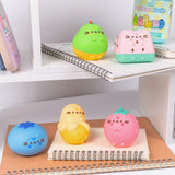Pusheen Fruits Surprise Squishys sit atop desk shelves. Each squishy (except blueblerry) feature Pusheen's four paws extending slightly off the front of the 3D figure.