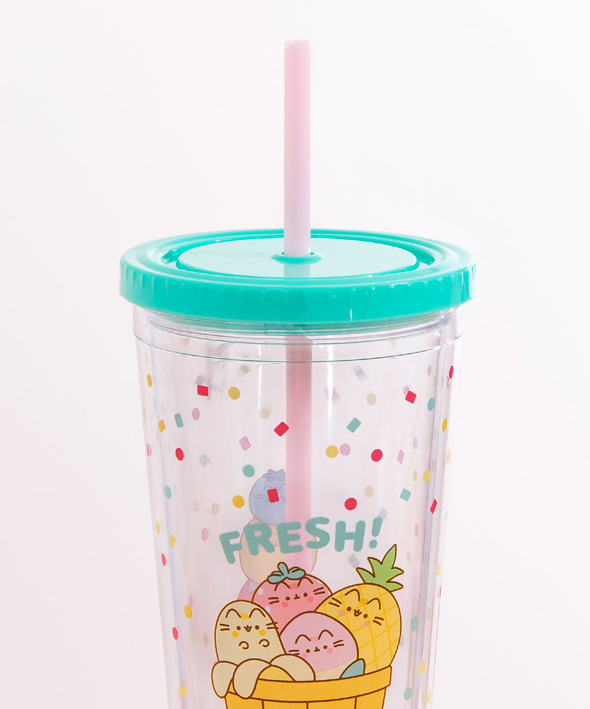 Close-up view of the mint green screw top lid on the Pusheen Fruits Tumbler. Coming out of the top is a light pink straw. 