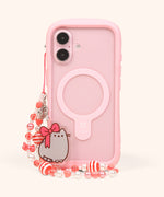 Pusheen Holiday Beaded Phone Charm attached to top corner of a phone. The acrylic charm stands upright in front of the case.