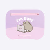 Front view of the Pusheen Laptod Pad. The purple pad has light pink and light purple details and tray inserts. The graphic of Pusheen shows her with a greay laptop.