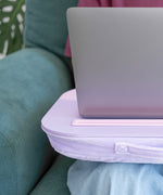 Side view of the laptop pad showcasing the purple padded bottom that allows the user to comfortably rest the tray on their legs.