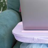 Side view of the laptop pad showcasing the purple padded bottom that allows the user to comfortably rest the tray on their legs.