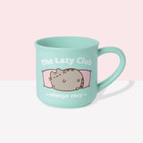 Back view of Pusheen mint green mug. The mint green cup features a grey and brown graphic of Pusheen winking and being lazy. The graphic on the back matches the graphic on the front. 