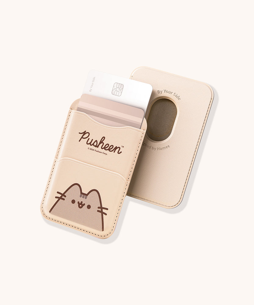 Front and back view of the beige Pusheen Magnetic Phone Wallet. The front has two pockets and a graphic of Pusheen the Cat. The back shows an open hole in the rounded rectangular wallet so that the user can easily remove their cards from the pocket.