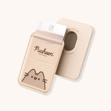 Front and back view of the beige Pusheen Magnetic Phone Wallet. The front has two pockets and a graphic of Pusheen the Cat. The back shows an open hole in the rounded rectangular wallet so that the user can easily remove their cards from the pocket.