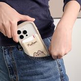 Model places a phone in their pocket that has the Pusheen Magnetic Phone Wallet attached to the back. The beige case is slim enough to fit in pockets easily and strong enough that the wallet will not fall off the phone. 