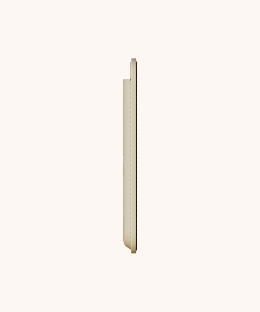 Side view of the beige magsafe phone wallet. The two-pocket phone wallet is thin so the user can comfortably carry and store their phone on the go.  