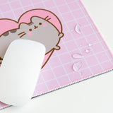 Close-up of water droplets sitting on top of the mouse pad to demonstrate the fabric's waterproof feature.