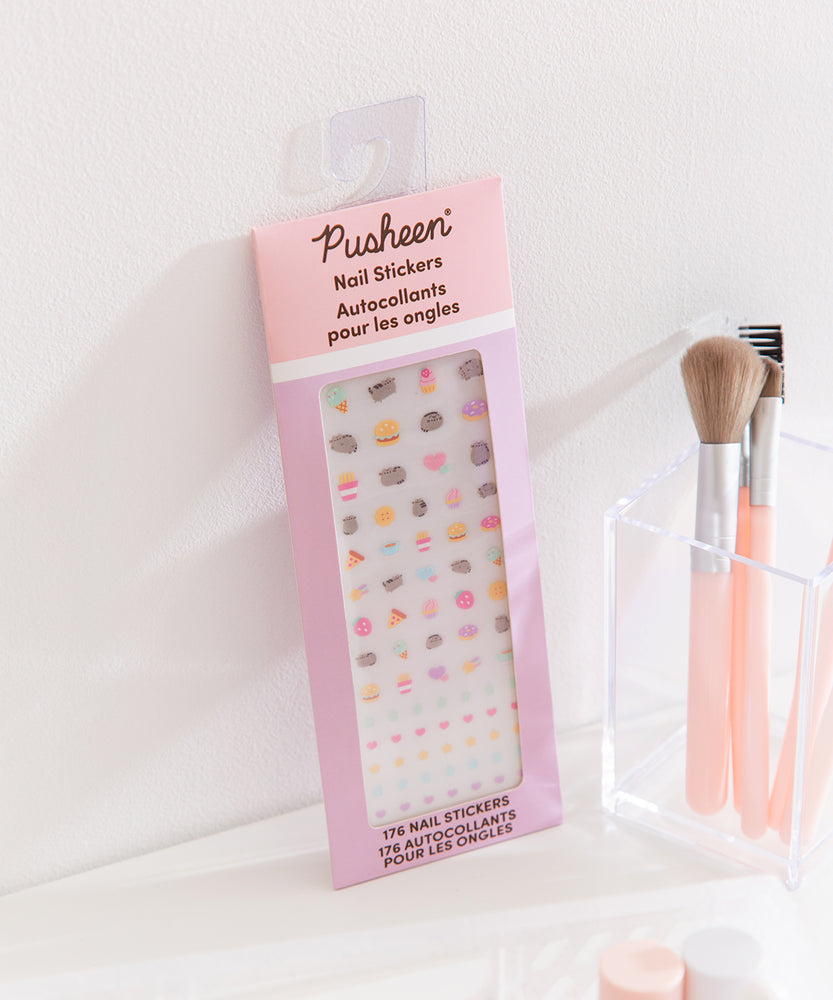 Pastel colored Pusheen nail stickers. The sticker set includes ice cream, cupcake, pizza, stars, and more decals. 