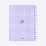 Back cover of the Pusheen notebook. The light purple notebook has a grid pattern. The elastic band to keep the notebook closed is attached on the corners of the back cover.