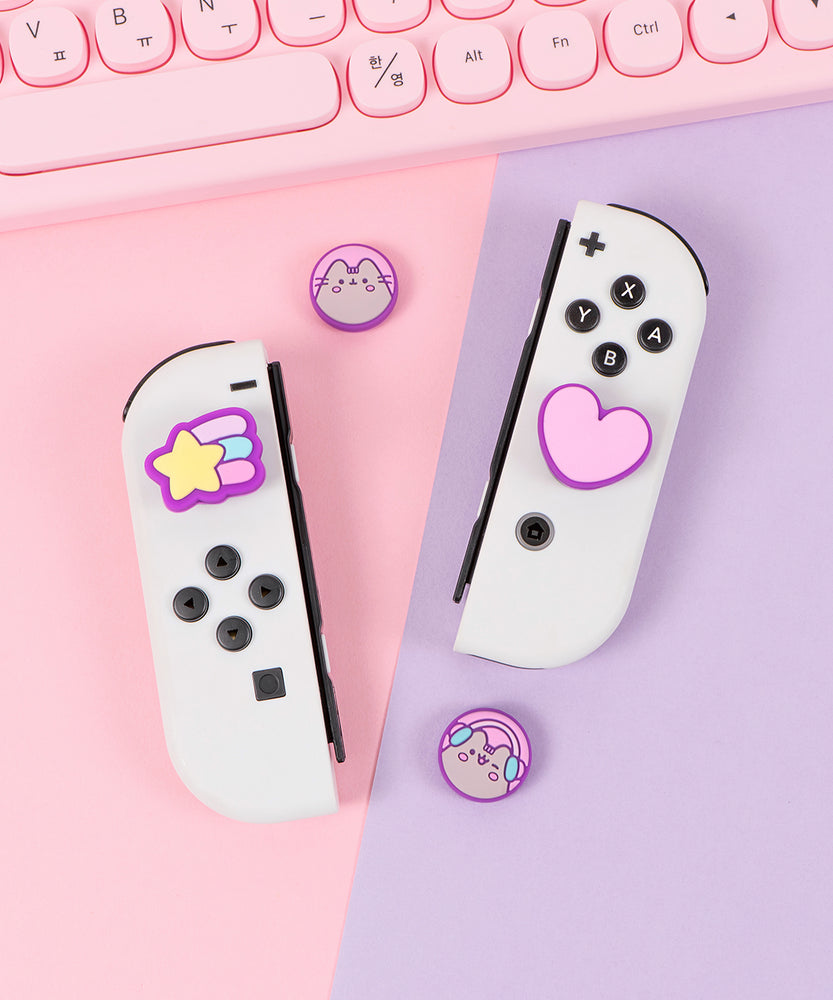 Front view of the Pusheen Nintendo Thumb Grip Caps. Two caps feature Pusheen the Cat's blushing face and two feature classic Pusheen icons including a heart and shooting star.